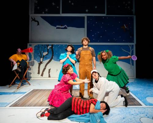 Rolando Cardona issues feedback as Caitlin Sarwono, Karin Terry, Jeremy Steckler, Tessa "Cricket" James, Rhys Daly, and Chloe Michele stand in tableau in A Charlie Brown Christmas at Taproot Theatre. Photo by Robert Wade Photography.