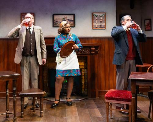 Peter Cook and Jeff Allen Pierce quaff ale as Chloe Michele looks on in Lewis and Tolkien at Taproot Theatre. Photo by Robert Wade Photography.