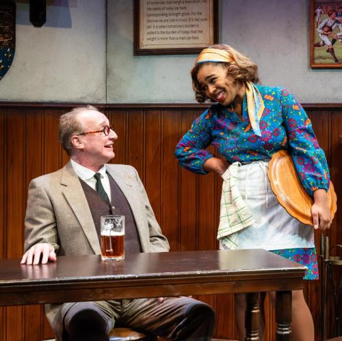 Peter Cook and Chloe Michele have a laugh in Lewis and Tolkien at Taproot Theatre. Photo by Robert Wade Photography.