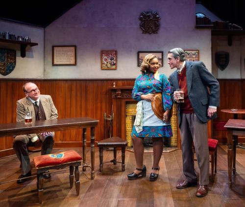 Peter Cook observes as Chloe Michele and Jeff Allen Pierce confer in Lewis and Tolkien at Taproot Theatre. Photo by Robert Wade Photography.