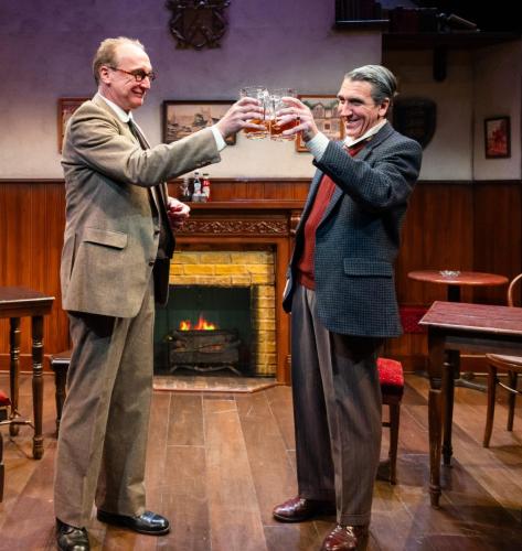 Peter Cook and Jeff Allen Pierce toast in Lewis and Tolkien at Taproot Theatre. Photo by Robert Wade Photography.