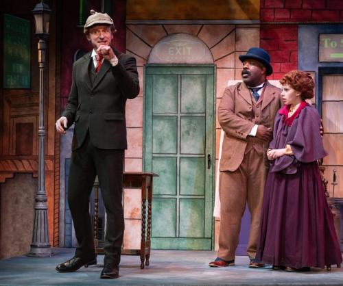 Calder Jameson Shilling with Nathaniel Tenenbaum and Sophia Franzella in Sherlock Holmes and the Precarious Position at Taproot Theatre. Photo by Robert Wade.