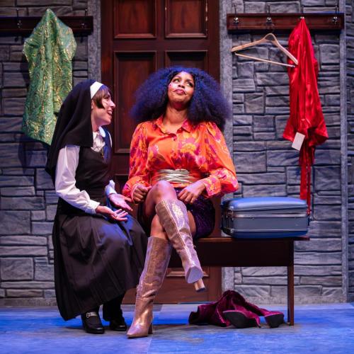 Rebecca Cort and Alexandria J. Henderson in Sister Act at Taproot Theatre. Photo by Robert Wade.